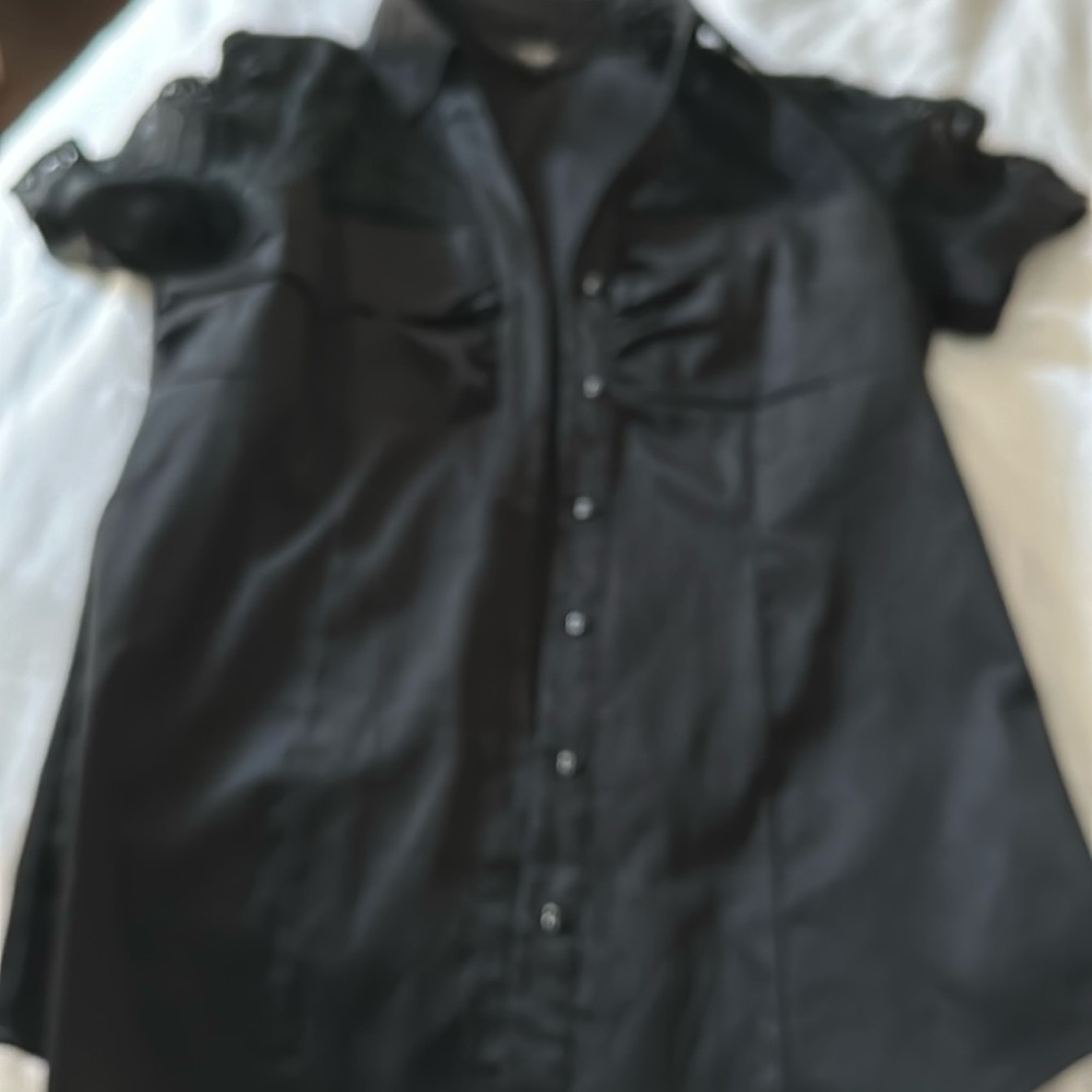 Very nice stretch black top with lace detail on both sleeves.